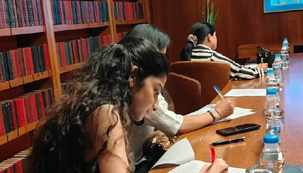 Participant taking notes during a session