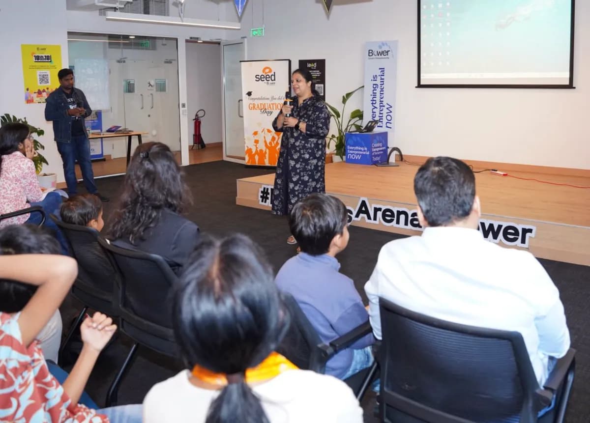 A SEED facilitator addressing students and parents at an in-school session in the Bower Founders Arena